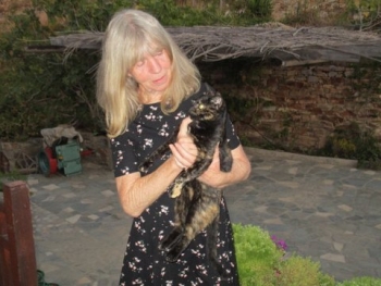 Carol McBeth, holding one of the stray cats she cares for