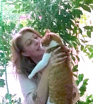 Marina Nikolakopoulou holds a former stray cat
