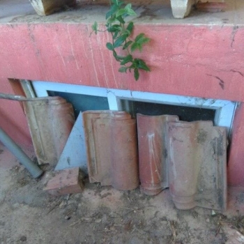 Α skylight blocked with bricks.