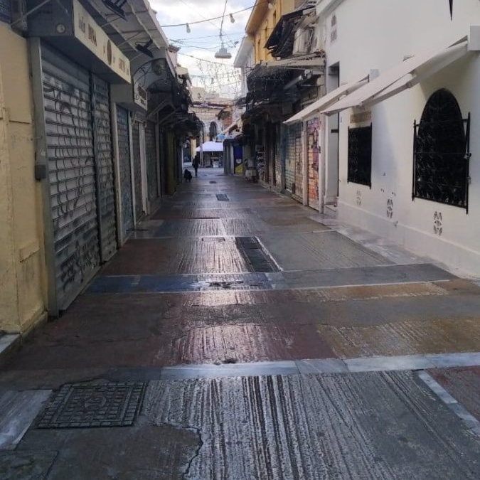 An empty Monastiraki during the pandemic affects stray cat care.