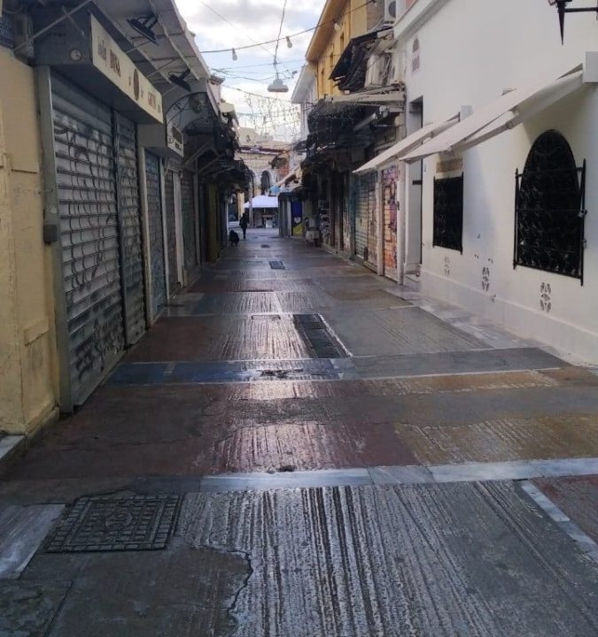An empty Monastiraki during the pandemic affects stray cat care.