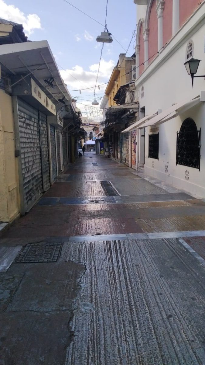 An empty Monastiraki during the pandemic affects stray cat care.