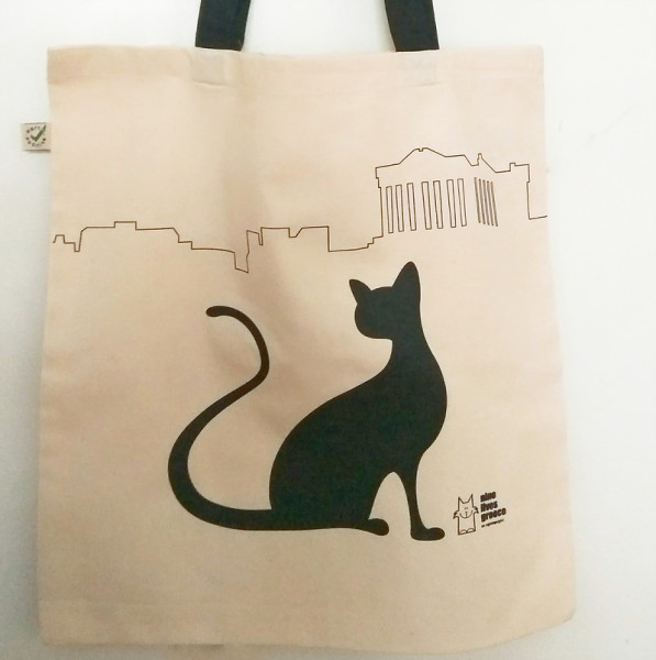 A tote bag in our Shop featuring an outline of the Acropolis and a stylized black cat