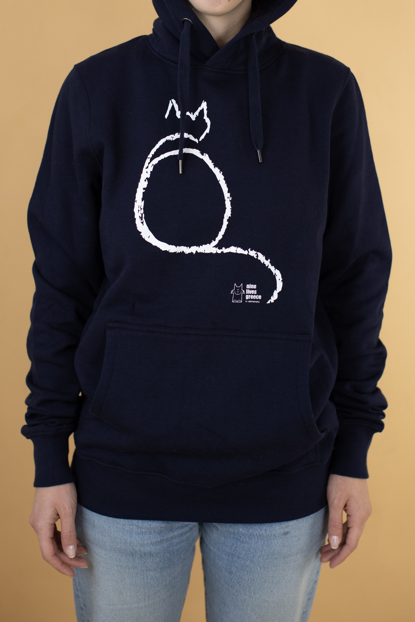 A denim blue hoodie with pockets with a sitting cat print.